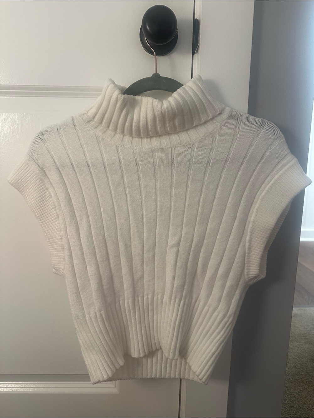 Sleeveless White Ribbed Turtleneck Knit Top